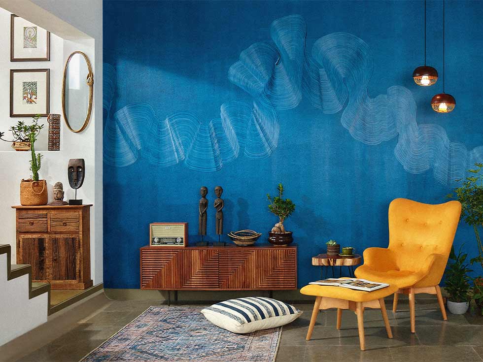 Blue textured accent wall designs with a yellow sofa chair - Bea